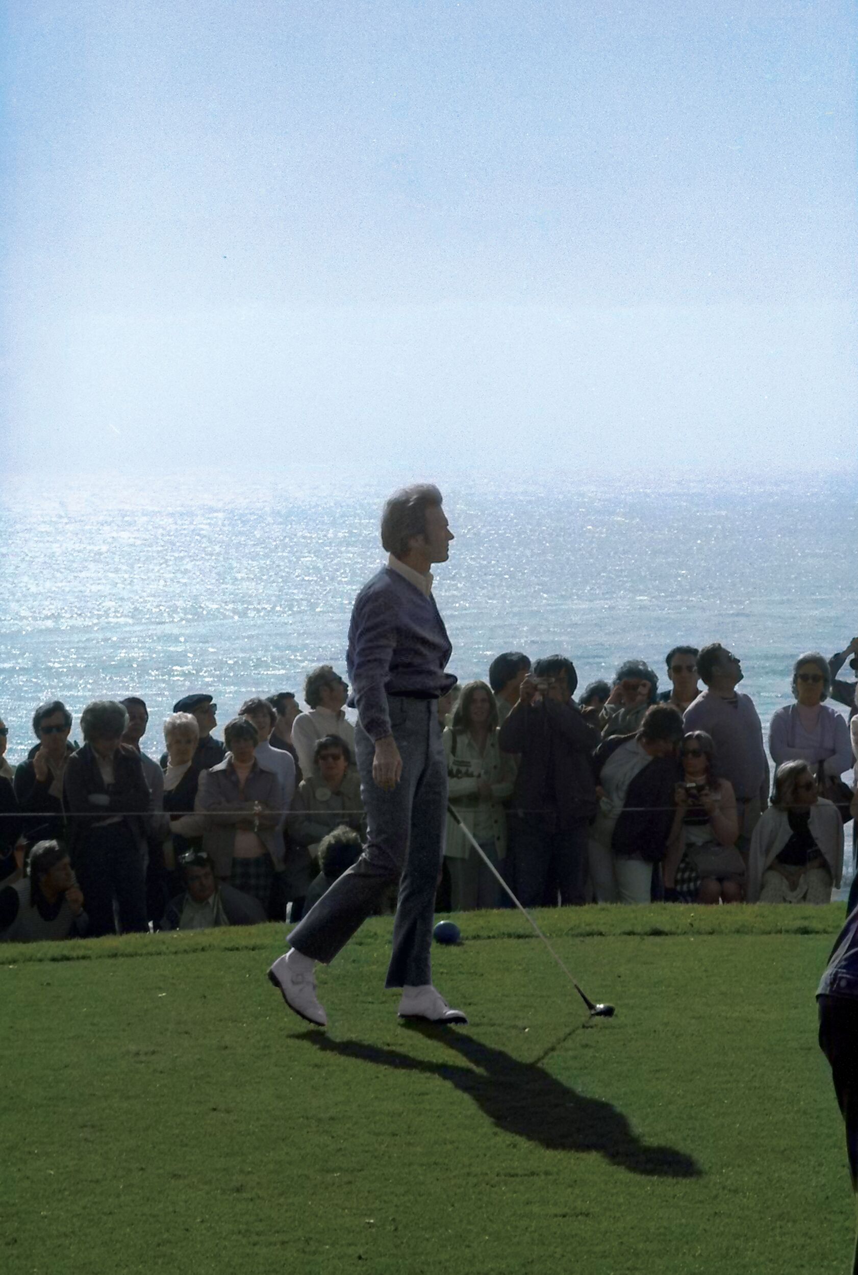 A young Clint Eastwood tracks his tee shot down the fairway at the AT&T Pebble Beach Pro-Am.