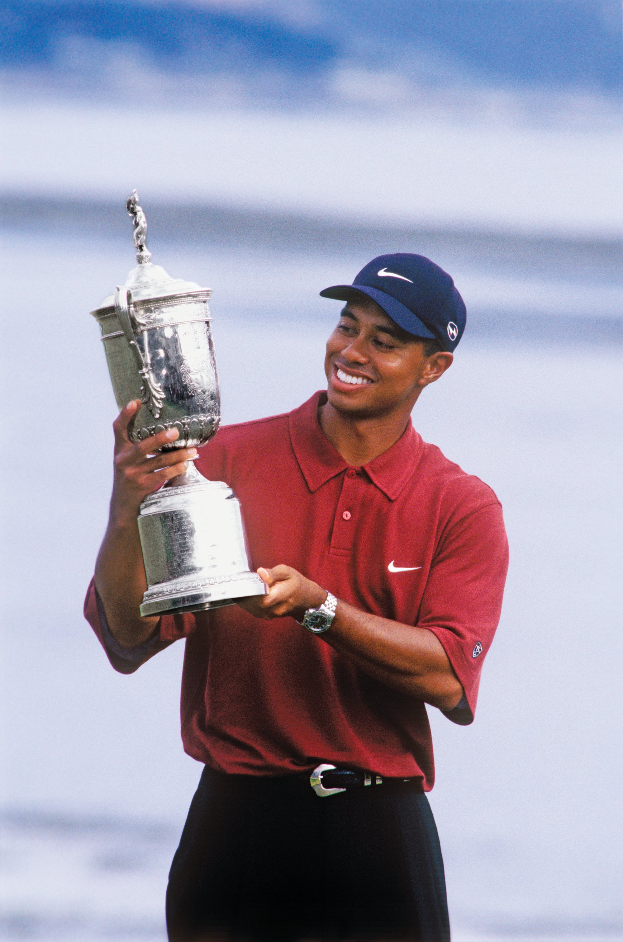tiger_woods_with_trophy_1_c_pebble_beach_company_edit