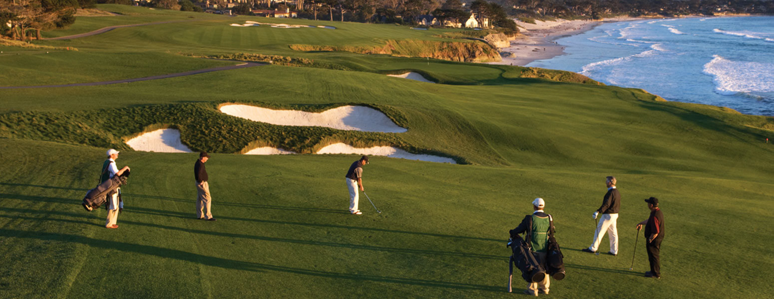 Group golfing on the green