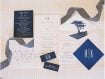 Close up of wedding invitation suite layout with blue and white details, Lone Cypress envelope liner