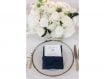 Wedding table setting with gold flatware navy blue linens and white flowers