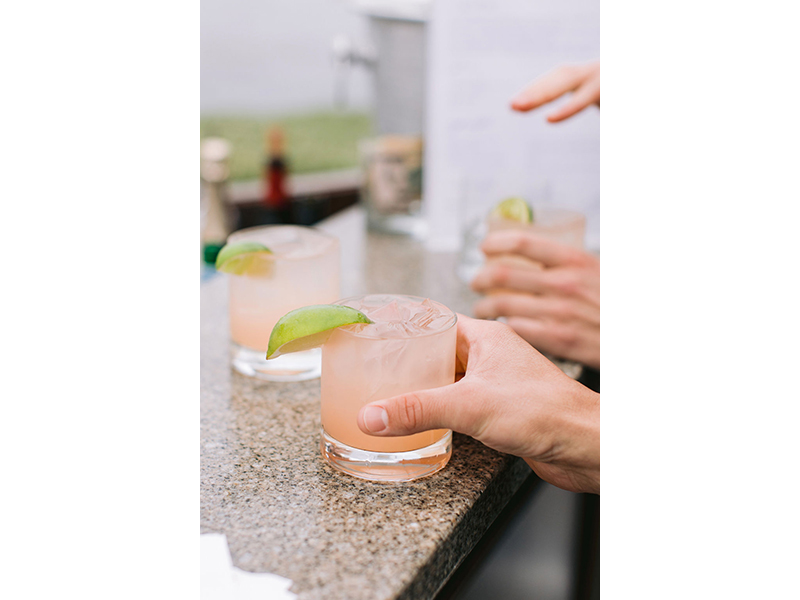 Close-up of pink cocktails with with lime garnish