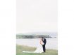 Bride and groom kissing at Pebble Beach Golf Links
