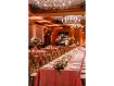 Spanish Bay ballroom set up for wedding reception with pink tablecloths and florals