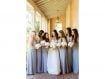 Bride with bridesmaids in grey holding white bouquets