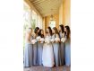 Bride with bridesmaids in grey holding white bouquets