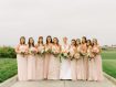 Bride and ten bridesmaids lined up at Spanish Bay