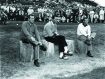 Arnold Palmer sitting with two men on a golf course at Pebble Beach
