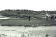 Arnold Palmer putting on a golf course at Pebble Beach