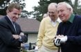 Arnold Palmer with two men on a golf course at Pebble Beach
