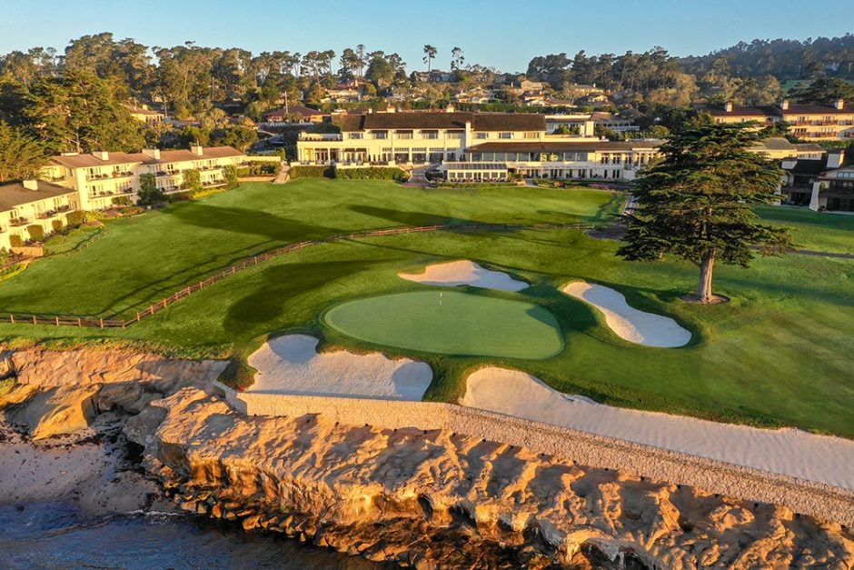 The 18th green of pebble beach golf links with The Lodge in the background