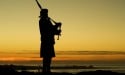 Our famed bagpiper at The Inn at Spanish Bay